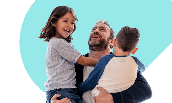 Dad holding his children in his arms